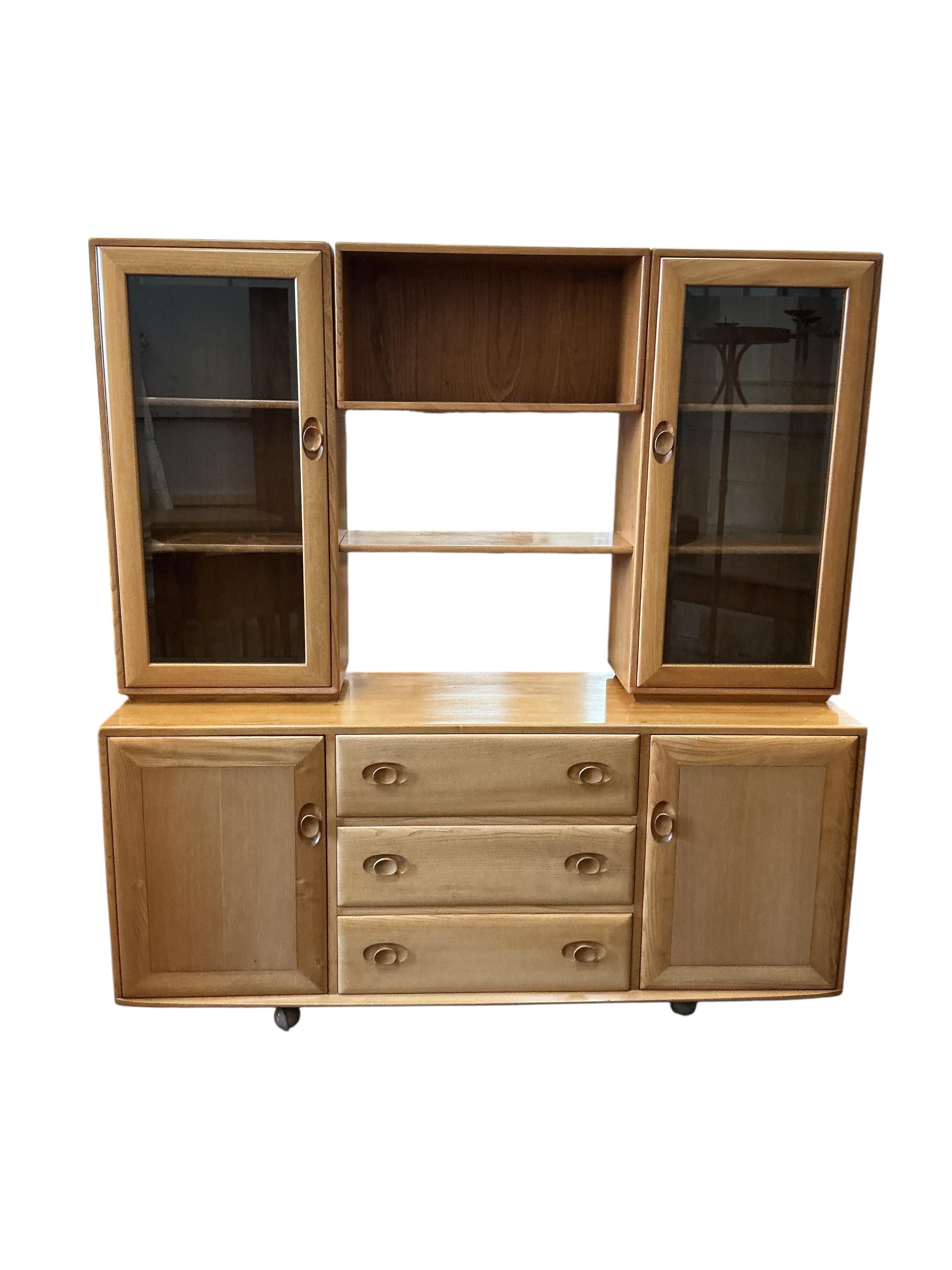 An Ercol Windsor light elm sideboard, width 155cm, depth 44cm, height 162cm